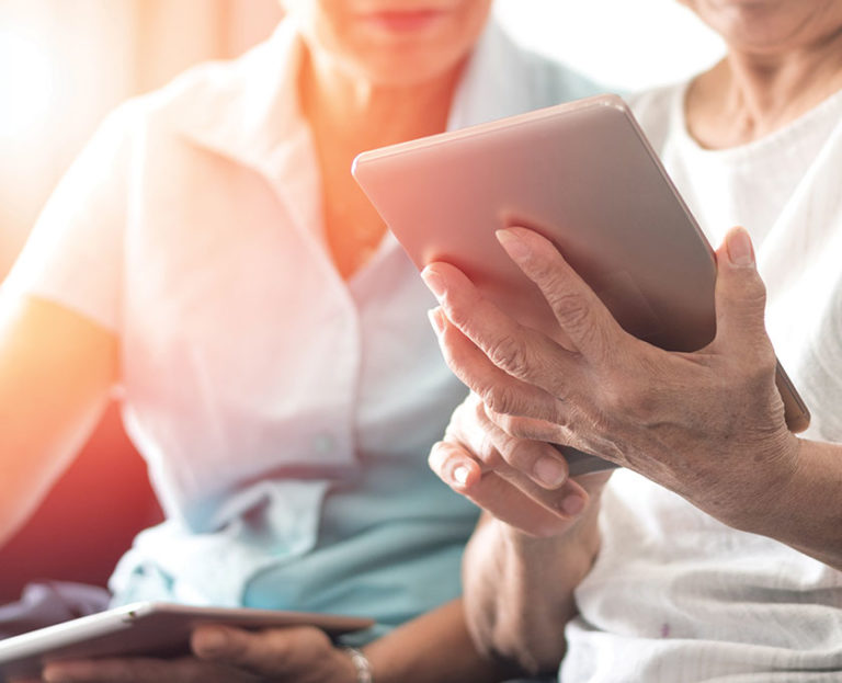 Hands holding iPad